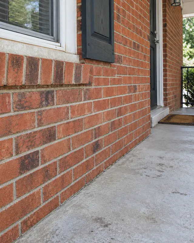 Example, after: mildew on brick and a porch slab